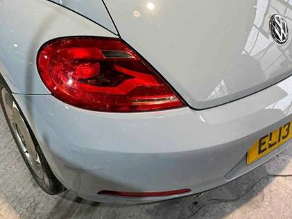 White car rear bumper after repair and refinishing