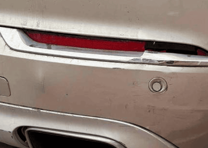 Scuff damage on a rear bumper before lease car return repair