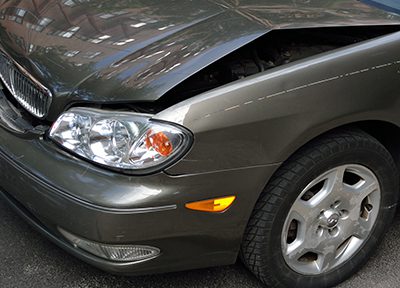 Grey car undergoing a vehicle bodywork damage assessment