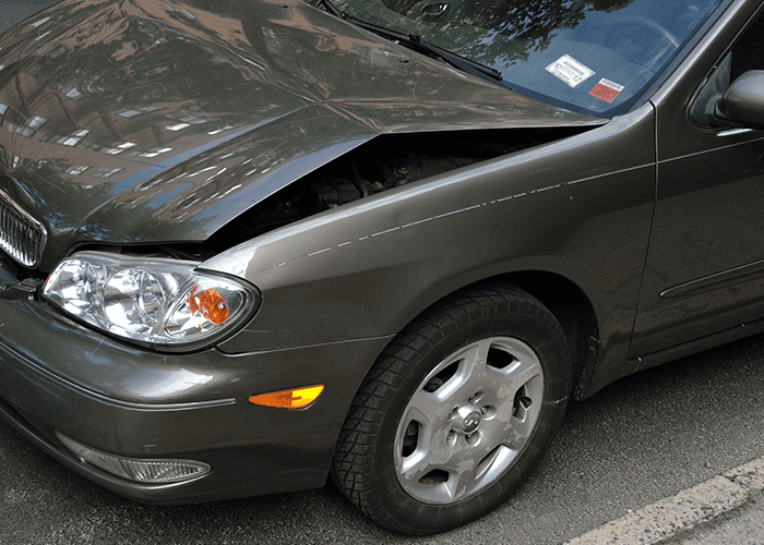 Grey car being inspected for a vehicle body repair estimate