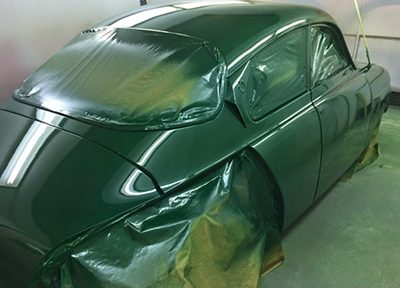 Vehicle masked and prepared for paint repair and respraying