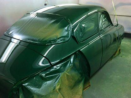 Vehicle masked and prepared for paint repair and respraying